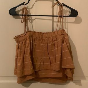 super cute mustard yellow and white striped flowy crop top with tie straps.